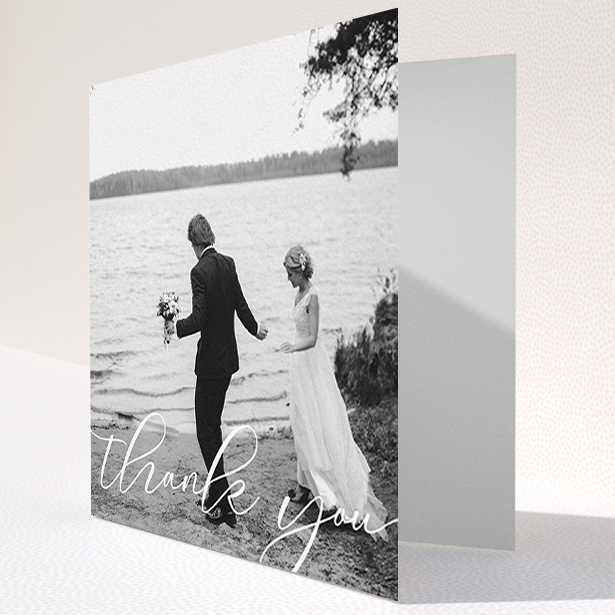A wedding thank you card design titled "One Photo". It is a square (148mm x 148mm) card in a square orientation. It is a photographic wedding thank you card with room for 1 photo. "One Photo" is available as a folded card, with mainly white colouring.