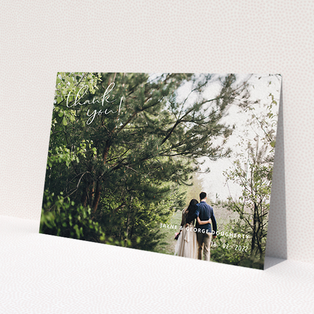 A wedding thank you card called 'Opposite Photo Corners'. It is an A6 card in a landscape orientation. It is a photographic wedding thank you card with room for 1 photo. 'Opposite Photo Corners' is available as a flat card, with mainly white colouring.