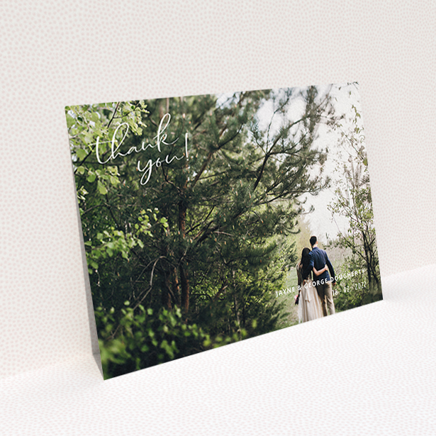 A wedding thank you card called "Opposite Photo Corners". It is an A6 card in a landscape orientation. It is a photographic wedding thank you card with room for 1 photo. "Opposite Photo Corners" is available as a flat card, with mainly white colouring.