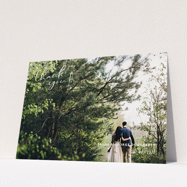 A wedding thank you card called "Opposite Photo Corners". It is an A6 card in a landscape orientation. It is a photographic wedding thank you card with room for 1 photo. "Opposite Photo Corners" is available as a flat card, with mainly white colouring.