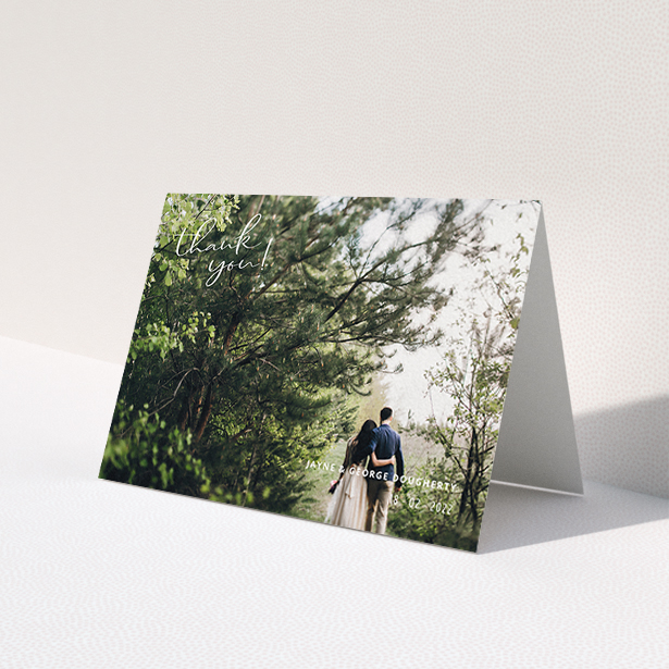 A wedding thank you card design titled 'Opposite Photo Corners'. It is an A6 card in a landscape orientation. It is a photographic wedding thank you card with room for 1 photo. 'Opposite Photo Corners' is available as a folded card, with mainly white colouring.