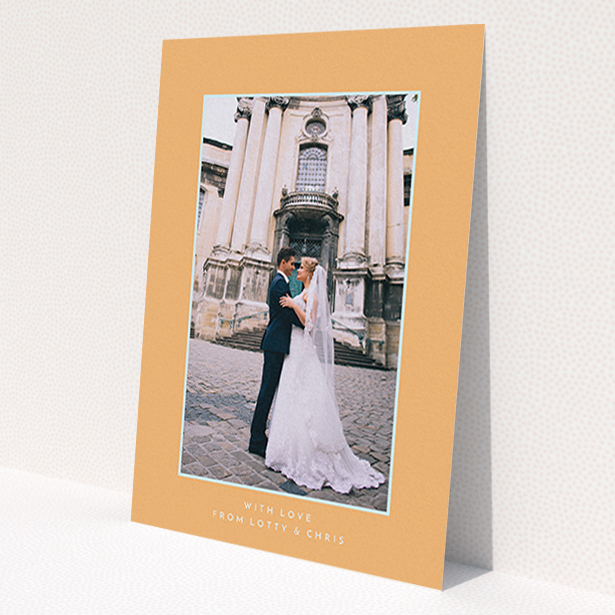 A wedding thank you card design called 'Orange and blue'. It is an A6 card in a portrait orientation. It is a photographic wedding thank you card with room for 1 photo. 'Orange and blue' is available as a flat card, with tones of orange and blue.