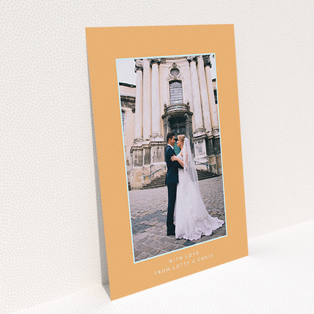 A wedding thank you card design called "Orange and blue". It is an A6 card in a portrait orientation. It is a photographic wedding thank you card with room for 1 photo. "Orange and blue" is available as a flat card, with tones of orange and blue.