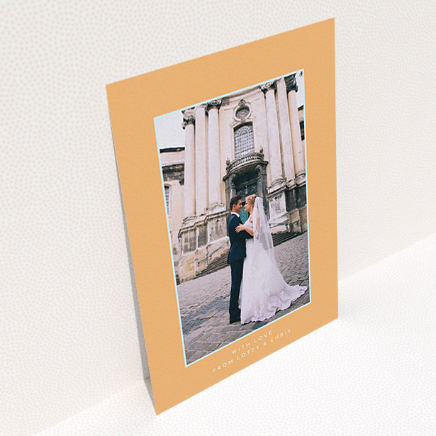 A wedding thank you card design called "Orange and blue". It is an A6 card in a portrait orientation. It is a photographic wedding thank you card with room for 1 photo. "Orange and blue" is available as a flat card, with tones of orange and blue.
