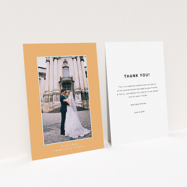 A wedding thank you card design called "Orange and blue". It is an A6 card in a portrait orientation. It is a photographic wedding thank you card with room for 1 photo. "Orange and blue" is available as a flat card, with tones of orange and blue.
