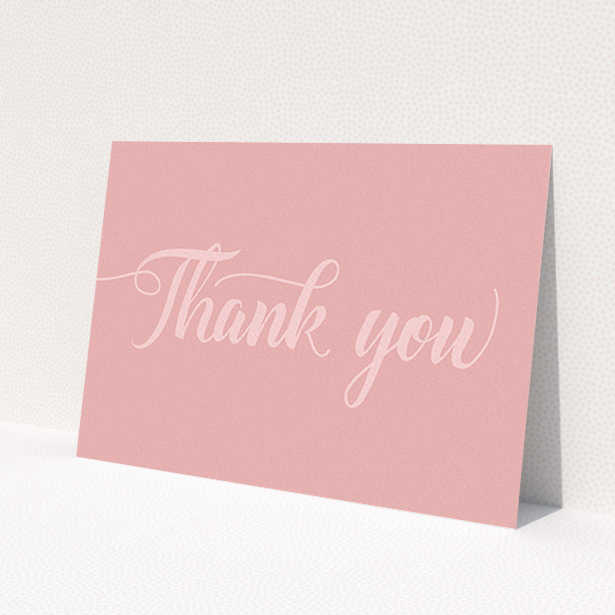 A wedding thank you card named 'Pastel pink calligraphy'. It is an A6 card in a landscape orientation. 'Pastel pink calligraphy' is available as a flat card, with mainly pink colouring.