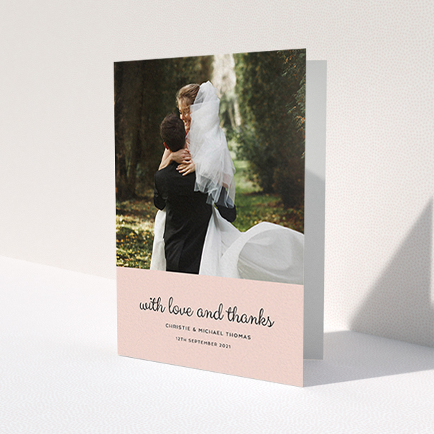 A wedding thank you card design named 'Pink Footer'. It is an A6 card in a portrait orientation. It is a photographic wedding thank you card with room for 1 photo. 'Pink Footer' is available as a folded card, with mainly pink colouring.