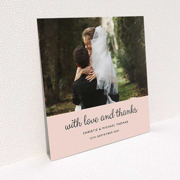 A wedding thank you card design titled "Pink Footer". It is a square (148mm x 148mm) card in a square orientation. It is a photographic wedding thank you card with room for 1 photo. "Pink Footer" is available as a flat card, with mainly pink colouring.