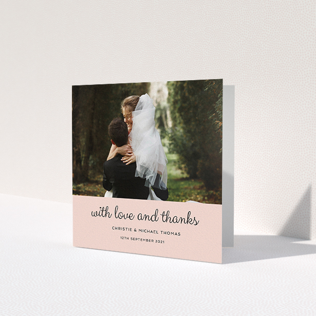 A wedding thank you card called 'Pink Footer'. It is a square (148mm x 148mm) card in a square orientation. It is a photographic wedding thank you card with room for 1 photo. 'Pink Footer' is available as a folded card, with mainly pink colouring.