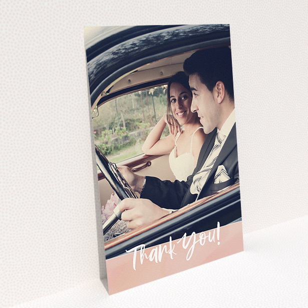 A wedding thank you card named "Pretty on Pink". It is an A5 card in a portrait orientation. It is a photographic wedding thank you card with room for 1 photo. "Pretty on Pink" is available as a flat card, with tones of pink and white.
