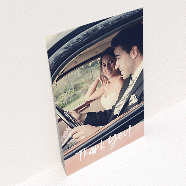 A wedding thank you card named "Pretty on Pink". It is an A5 card in a portrait orientation. It is a photographic wedding thank you card with room for 1 photo. "Pretty on Pink" is available as a flat card, with tones of pink and white.