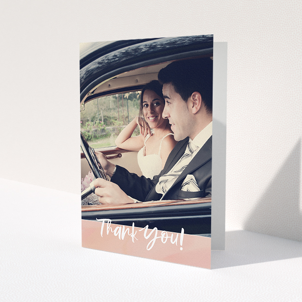 A wedding thank you card design called 'Pretty on Pink'. It is an A5 card in a portrait orientation. It is a photographic wedding thank you card with room for 1 photo. 'Pretty on Pink' is available as a folded card, with tones of pink and white.