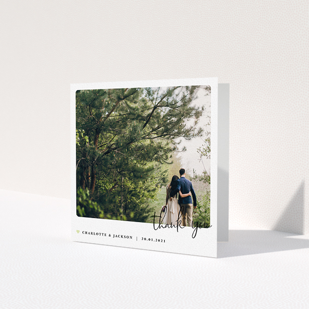 A wedding thank you card called 'Rounded-Off with Thanks'. It is a square (148mm x 148mm) card in a square orientation. It is a photographic wedding thank you card with room for 1 photo. 'Rounded-Off with Thanks' is available as a folded card, with mainly white colouring.