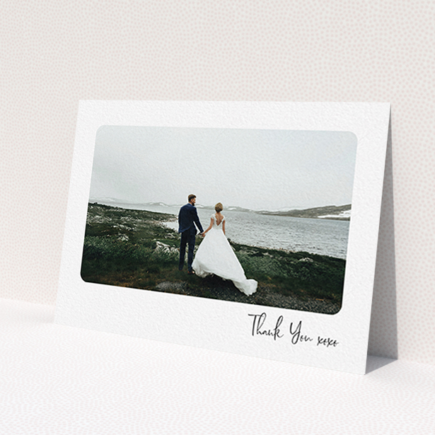 A wedding thank you card called 'Rounded Thanks'. It is an A6 card in a landscape orientation. It is a photographic wedding thank you card with room for 1 photo. 'Rounded Thanks' is available as a flat card, with mainly white colouring.