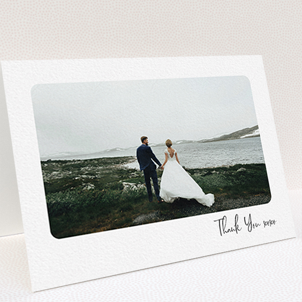 A wedding thank you card design titled "Rounded Thanks". It is an A6 card in a landscape orientation. It is a photographic wedding thank you card with room for 1 photo. "Rounded Thanks" is available as a folded card, with mainly white colouring.