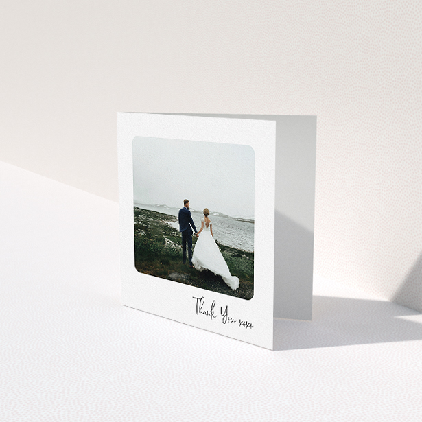 A wedding thank you card named "Rounded Thanks". It is a square (148mm x 148mm) card in a square orientation. It is a photographic wedding thank you card with room for 1 photo. "Rounded Thanks" is available as a folded card, with mainly white colouring.