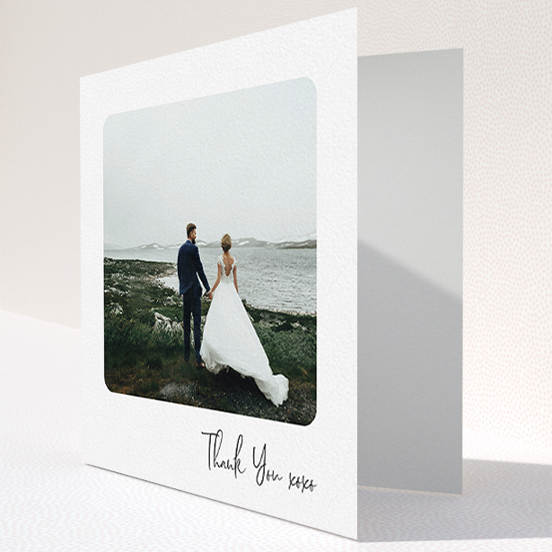 A wedding thank you card named "Rounded Thanks". It is a square (148mm x 148mm) card in a square orientation. It is a photographic wedding thank you card with room for 1 photo. "Rounded Thanks" is available as a folded card, with mainly white colouring.