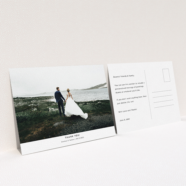 A wedding thank you card design named "Sans Serif". It is an A6 card in a landscape orientation. It is a photographic wedding thank you card with room for 1 photo. "Sans Serif" is available as a flat card, with mainly white colouring.
