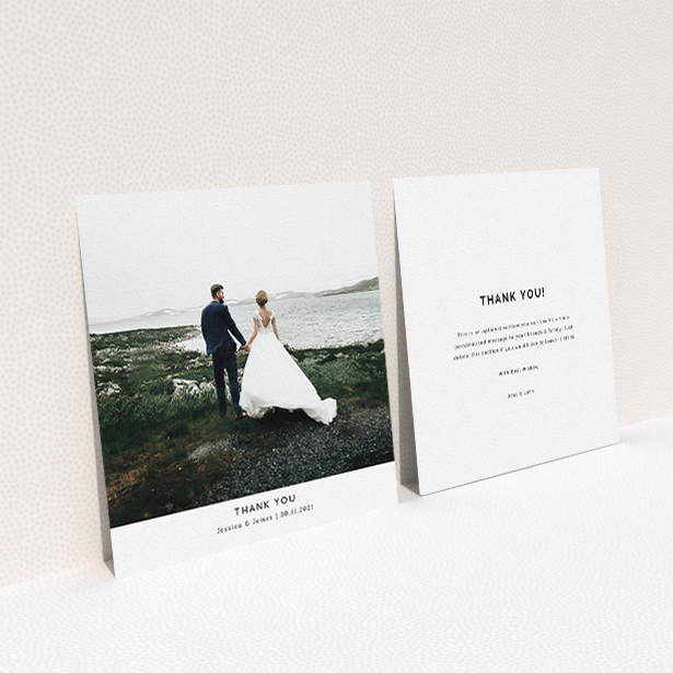 A wedding thank you card called "Sans Serif". It is a square (148mm x 148mm) card in a square orientation. It is a photographic wedding thank you card with room for 1 photo. "Sans Serif" is available as a flat card, with mainly white colouring.