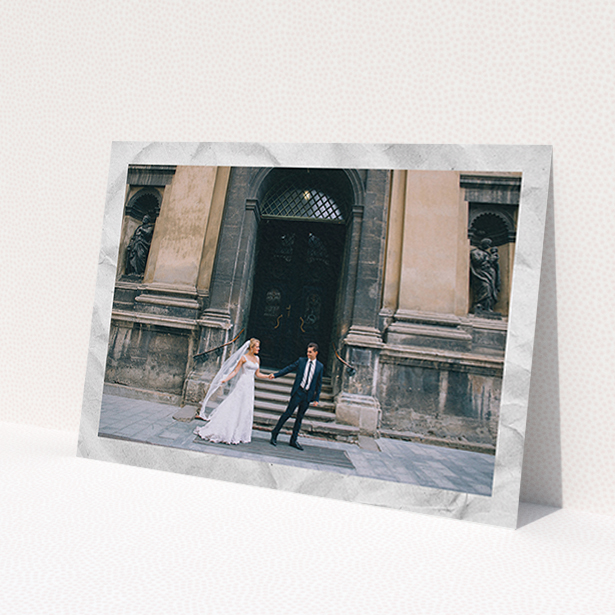 A wedding thank you card template titled 'Sat on Marble'. It is an A6 card in a landscape orientation. It is a photographic wedding thank you card with room for 1 photo. 'Sat on Marble' is available as a flat card, with mainly white colouring.