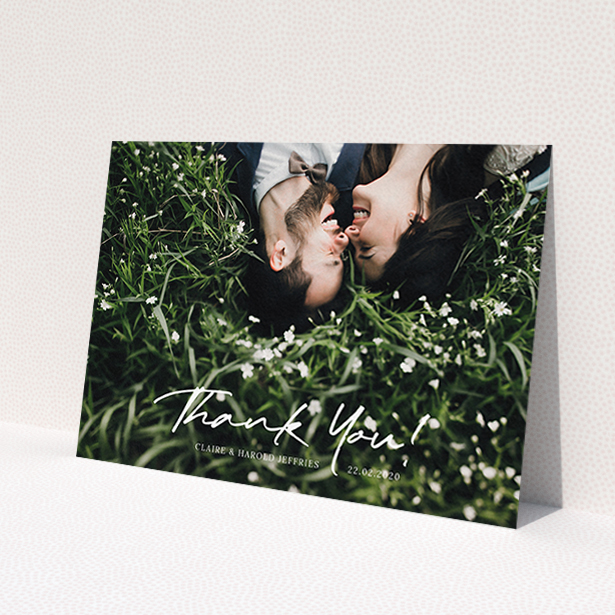A wedding thank you card design titled 'Simple Appreciation'. It is an A6 card in a landscape orientation. It is a photographic wedding thank you card with room for 1 photo. 'Simple Appreciation' is available as a flat card, with mainly white colouring.