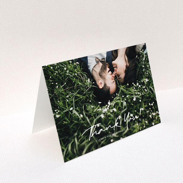 A wedding thank you card design named "Simple Appreciation". It is an A6 card in a landscape orientation. It is a photographic wedding thank you card with room for 1 photo. "Simple Appreciation" is available as a folded card, with mainly white colouring.
