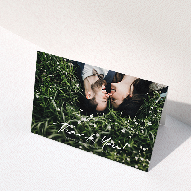 A wedding thank you card design named "Simple Appreciation". It is an A6 card in a landscape orientation. It is a photographic wedding thank you card with room for 1 photo. "Simple Appreciation" is available as a folded card, with mainly white colouring.