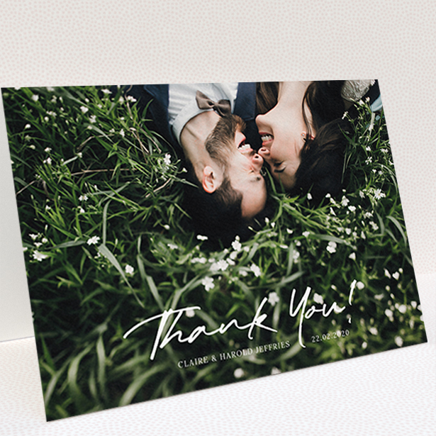 A wedding thank you card design named "Simple Appreciation". It is an A6 card in a landscape orientation. It is a photographic wedding thank you card with room for 1 photo. "Simple Appreciation" is available as a folded card, with mainly white colouring.