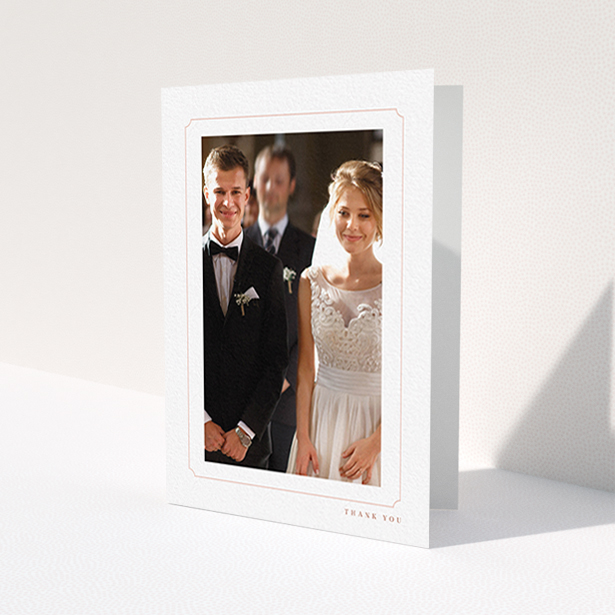 A wedding thank you card design called 'Simple fine border'. It is an A6 card in a portrait orientation. It is a photographic wedding thank you card with room for 1 photo. 'Simple fine border' is available as a folded card, with tones of white and pink.
