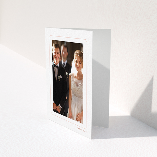 A wedding thank you card design called "Simple fine border". It is an A6 card in a portrait orientation. It is a photographic wedding thank you card with room for 1 photo. "Simple fine border" is available as a folded card, with tones of white and pink.