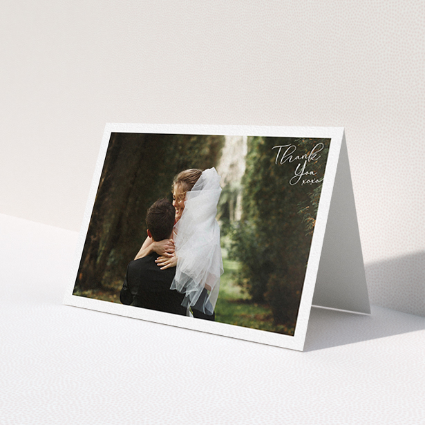A wedding thank you card called 'Simple Landscape Thanks'. It is an A6 card in a landscape orientation. It is a photographic wedding thank you card with room for 1 photo. 'Simple Landscape Thanks' is available as a folded card, with mainly white colouring.