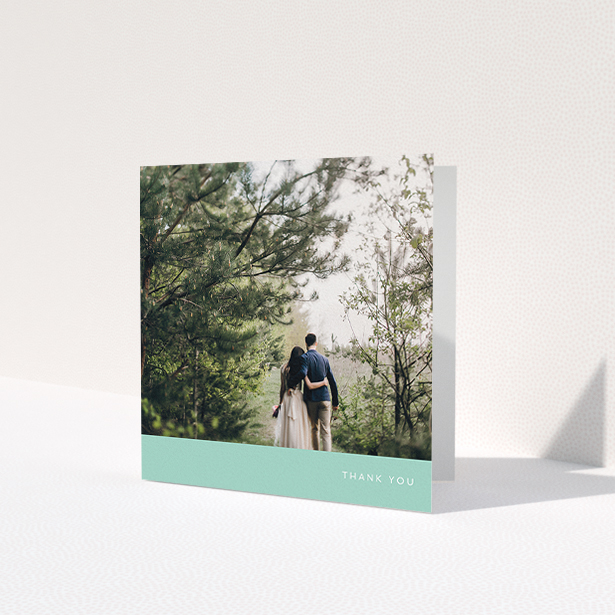 A wedding thank you card design called 'Simple Mint'. It is a square (148mm x 148mm) card in a square orientation. It is a photographic wedding thank you card with room for 1 photo. 'Simple Mint' is available as a folded card, with tones of green and white.