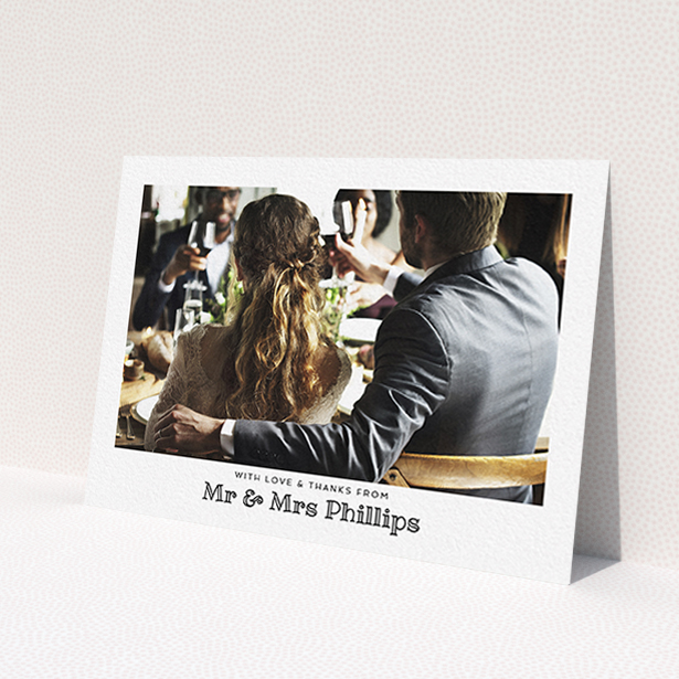 A wedding thank you card design called 'Simple Photo Frame'. It is an A6 card in a landscape orientation. It is a photographic wedding thank you card with room for 1 photo. 'Simple Photo Frame' is available as a flat card, with mainly white colouring.