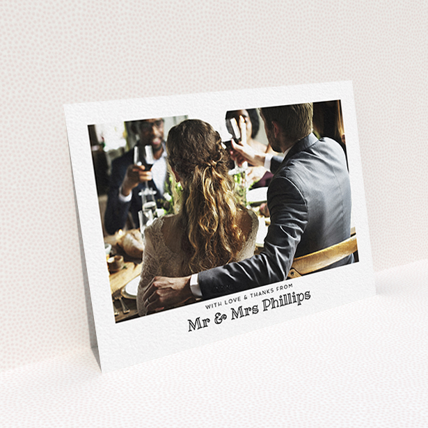 A wedding thank you card design called "Simple Photo Frame". It is an A6 card in a landscape orientation. It is a photographic wedding thank you card with room for 1 photo. "Simple Photo Frame" is available as a flat card, with mainly white colouring.