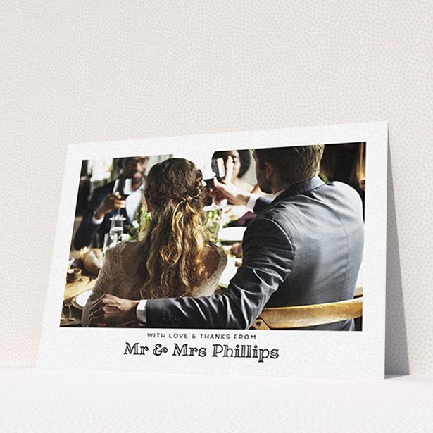 A wedding thank you card design called "Simple Photo Frame". It is an A6 card in a landscape orientation. It is a photographic wedding thank you card with room for 1 photo. "Simple Photo Frame" is available as a flat card, with mainly white colouring.