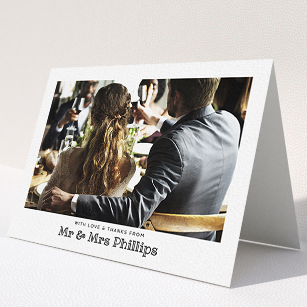 A wedding thank you card template titled "Simple Photo Frame". It is an A6 card in a landscape orientation. It is a photographic wedding thank you card with room for 1 photo. "Simple Photo Frame" is available as a folded card, with mainly white colouring.