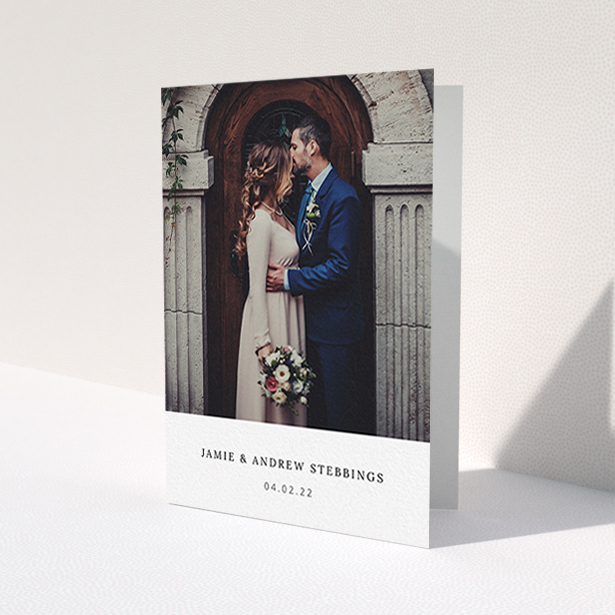A wedding thank you card template titled 'Simple, Portrait Thank You'. It is an A6 card in a portrait orientation. It is a photographic wedding thank you card with room for 1 photo. 'Simple, Portrait Thank You' is available as a folded card, with mainly white colouring.