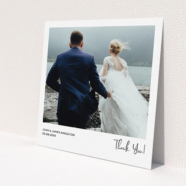 A wedding thank you card design named 'Simple Wedding Thank You'. It is a square (148mm x 148mm) card in a square orientation. It is a photographic wedding thank you card with room for 1 photo. 'Simple Wedding Thank You' is available as a flat card, with mainly white colouring.