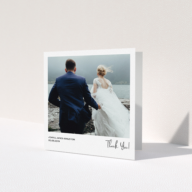 A wedding thank you card design titled 'Simple Wedding Thank You'. It is a square (148mm x 148mm) card in a square orientation. It is a photographic wedding thank you card with room for 1 photo. 'Simple Wedding Thank You' is available as a folded card, with mainly white colouring.