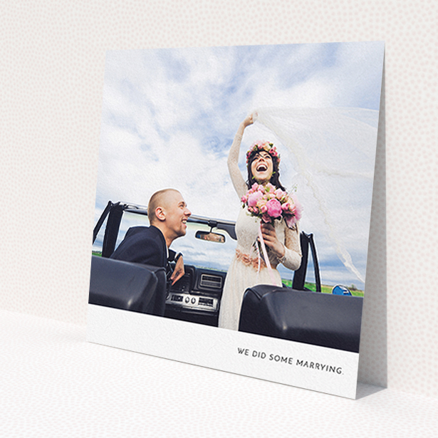 A wedding thank you card named 'Split into two'. It is a square (148mm x 148mm) card in a square orientation. It is a photographic wedding thank you card with room for 2 photos. 'Split into two' is available as a flat card, with mainly white colouring.