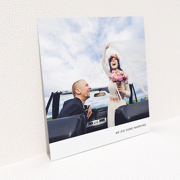 A wedding thank you card named "Split into two". It is a square (148mm x 148mm) card in a square orientation. It is a photographic wedding thank you card with room for 2 photos. "Split into two" is available as a flat card, with mainly white colouring.