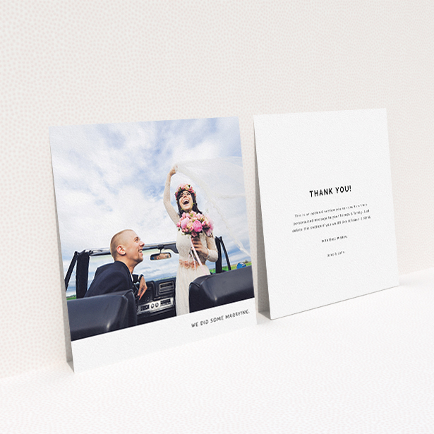 A wedding thank you card named "Split into two". It is a square (148mm x 148mm) card in a square orientation. It is a photographic wedding thank you card with room for 2 photos. "Split into two" is available as a flat card, with mainly white colouring.