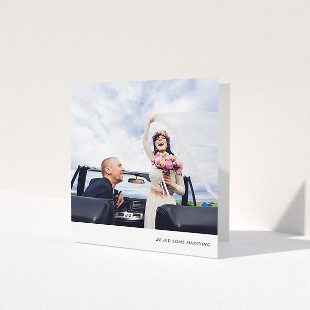 A wedding thank you card template titled 'Split into two'. It is a square (148mm x 148mm) card in a square orientation. It is a photographic wedding thank you card with room for 2 photos. 'Split into two' is available as a folded card, with mainly white colouring.