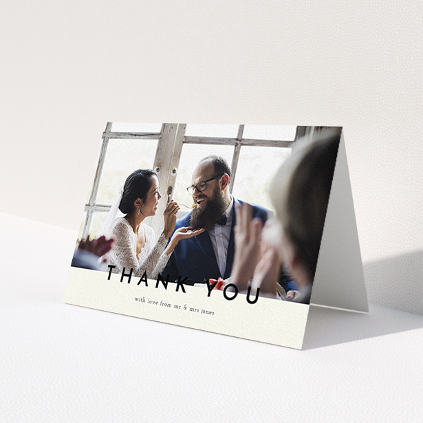A wedding thank you card design titled 'Split thank you '. It is an A6 card in a landscape orientation. It is a photographic wedding thank you card with room for 1 photo. 'Split thank you ' is available as a folded card, with mainly cream colouring.