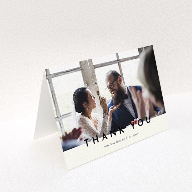 A wedding thank you card design titled "Split thank you ". It is an A6 card in a landscape orientation. It is a photographic wedding thank you card with room for 1 photo. "Split thank you " is available as a folded card, with mainly cream colouring.