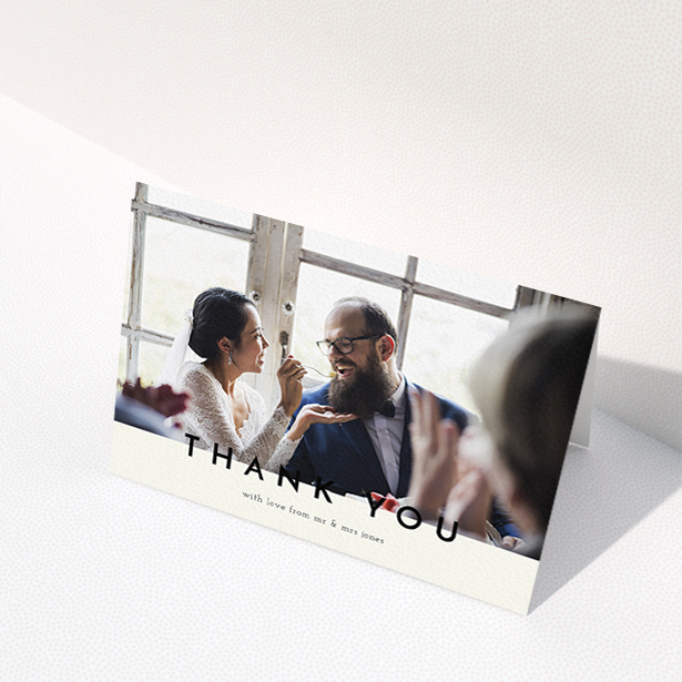 A wedding thank you card design titled "Split thank you ". It is an A6 card in a landscape orientation. It is a photographic wedding thank you card with room for 1 photo. "Split thank you " is available as a folded card, with mainly cream colouring.