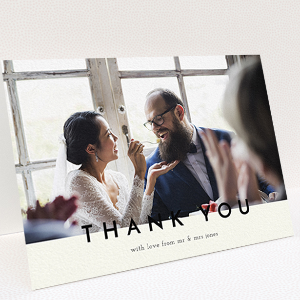 A wedding thank you card design titled "Split thank you ". It is an A6 card in a landscape orientation. It is a photographic wedding thank you card with room for 1 photo. "Split thank you " is available as a folded card, with mainly cream colouring.
