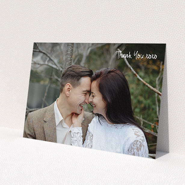 A wedding thank you card design titled 'Thank You XOXO'. It is an A6 card in a landscape orientation. It is a photographic wedding thank you card with room for 1 photo. 'Thank You XOXO' is available as a flat card, with mainly white colouring.