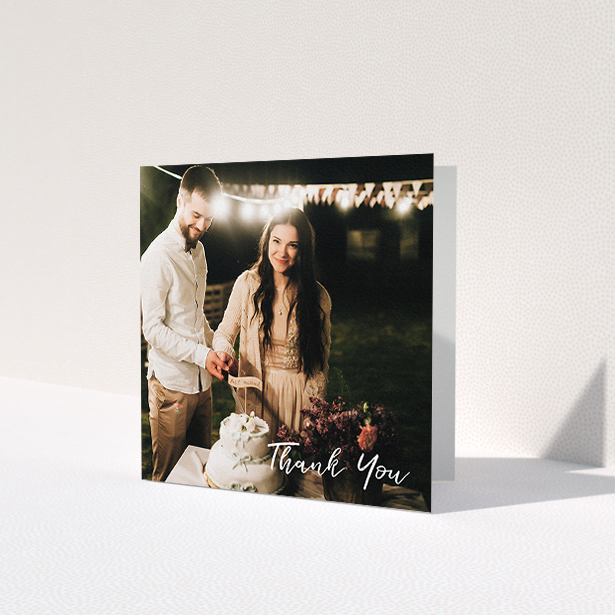 A wedding thank you card named 'Thanks From The Corner'. It is a square (148mm x 148mm) card in a square orientation. It is a photographic wedding thank you card with room for 1 photo. 'Thanks From The Corner' is available as a folded card, with mainly white colouring.