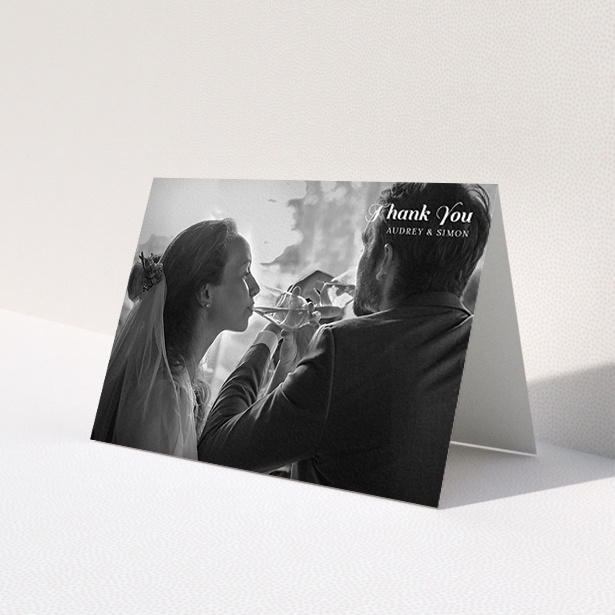 A wedding thank you card named 'Top-Right'. It is an A6 card in a landscape orientation. It is a photographic wedding thank you card with room for 1 photo. 'Top-Right' is available as a folded card, with mainly white colouring.